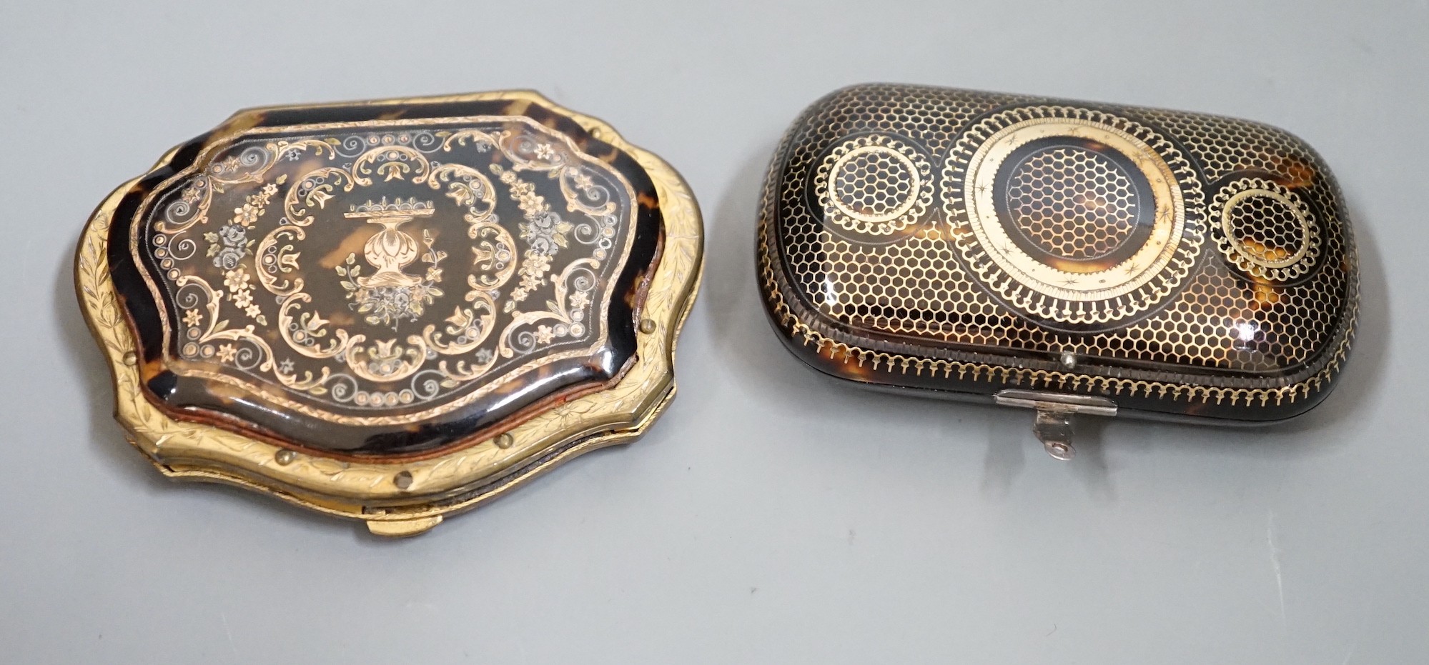 A 19th century finely worked tortoiseshell piqué work purse, with blue silk lining and a similar git metal edged piqué work purse